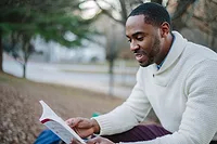 young-professiona;.jpg Young professional reads outdoors