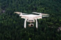 Drone flies over forest
