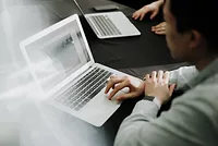 priscilla-du-preez-OEdkPaxYMXU-unsplash.jpg Man working on laptop computer