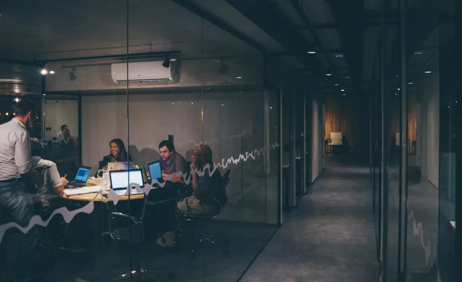 Employees meet in conference room