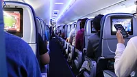 flight-g4cf2ae851_1920.jpg Business travelers in airplane