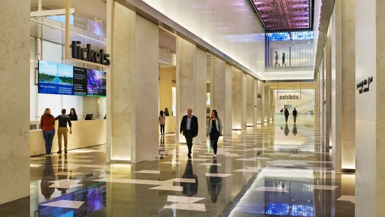 Visitors walk through the Museum of the Bible entrance.