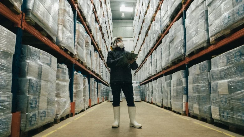 Warehouse worker with electronic device