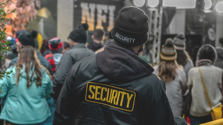 Security guard watches crowd