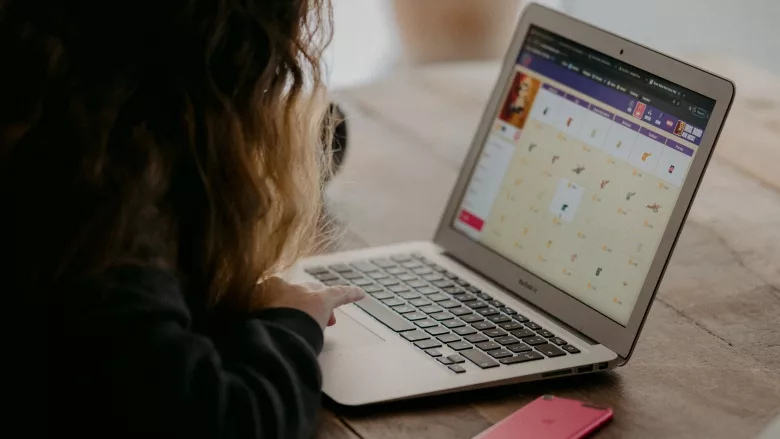 School student learns on laptop