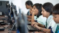 school students learn on computers