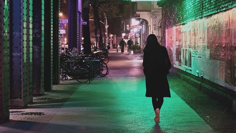 woman walks at night