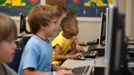 elementary school students on computers