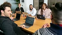 mapbox-ZT5v0puBjZI-unsplash (1).jpg employees in conference room