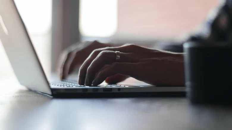 person typing on computer