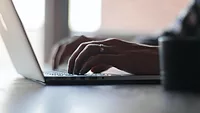 person typing on computer