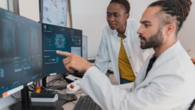 medical professionals looking at computer