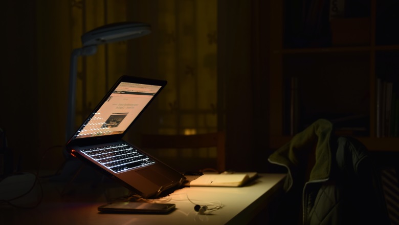 half open laptop on desk