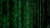 slightly blurred green text vertically on black screen