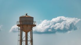 water tower in front of clouds
