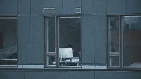 some working beside open window