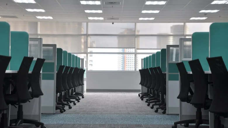 empty desk chairs in office