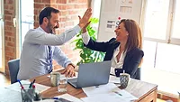 two people high fiving