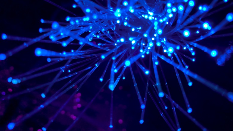 blue graphic with illuminated strands