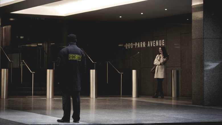 security guard standing by doors