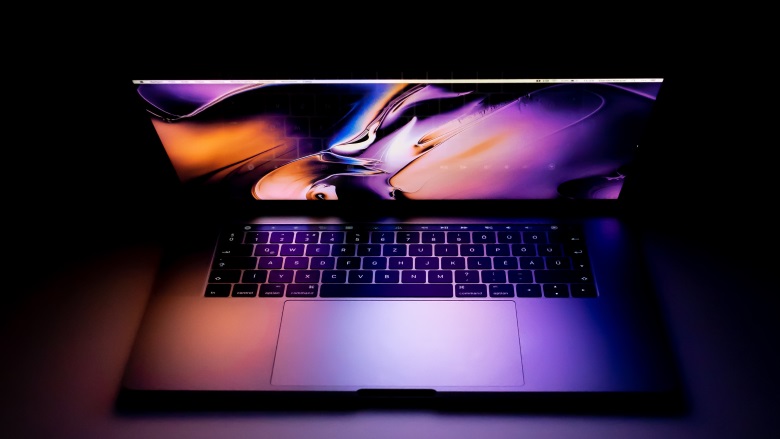 open laptop with purple screen