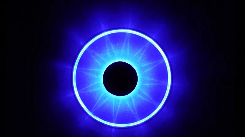 black circle with blue ring around it