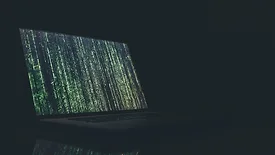 open computer with green vertical text