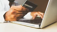 person paying online with credit card