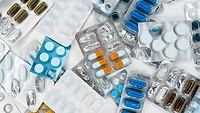 pill packs laying on white table pill packs laying on white table