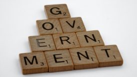scrabble tiles that spell Government
