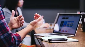 people working at shared desk