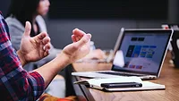 people working at shared desk