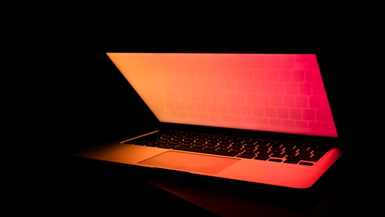 open laptop with orange screen