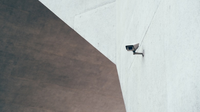 surveillance camera on white wall
