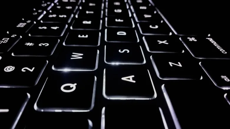 black keyboard with white letters