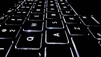 black keyboard with white letters