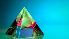 green and pink pyramid on blue screen