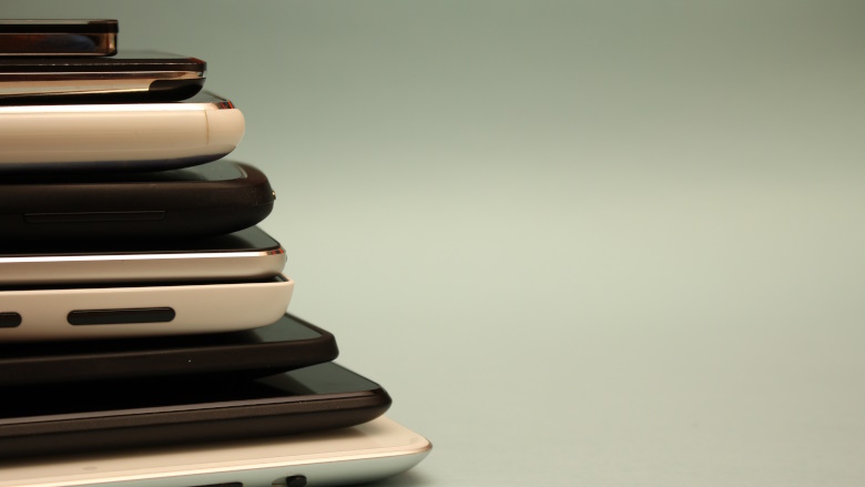 phones and tablets stacked on top of each other