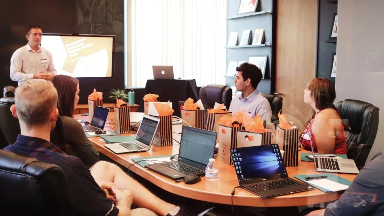 people working in conference room