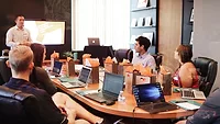 people working in conference room