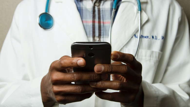 healthcare worker using phone