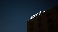 dark building with white hotel sign dark building with white hotel sign