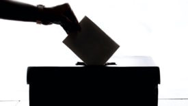 person using ballot box