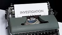 Typewriter with investigation written on a piece of paper Typewriter with investigation written on a piece of paper