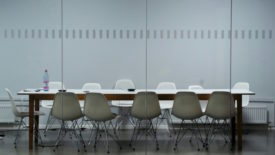 Conference room with white chairs
