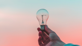 Lightbulb with gradient colorful background