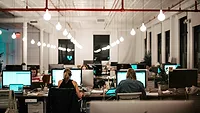 Office with workers on computers