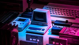 Older computers with pink and blue lighting