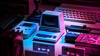 Older computers with pink and blue lighting