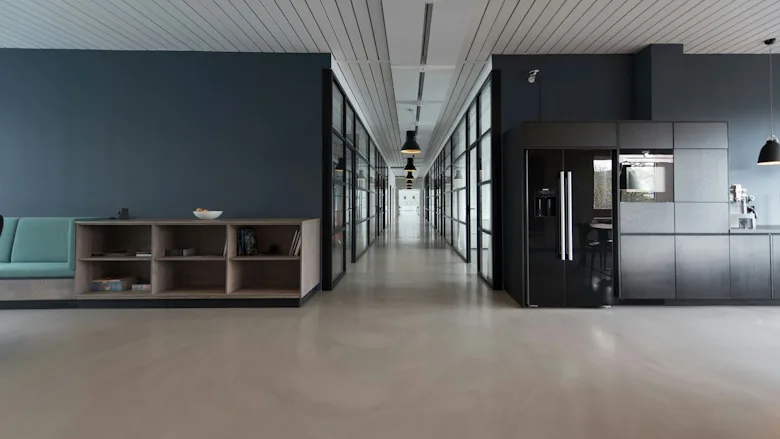 Office space with gray walls and floors
